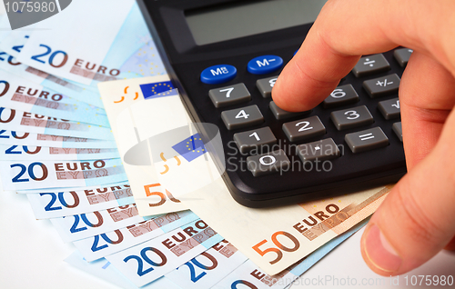 Image of Calculator and money - accounting concept