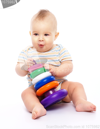 Image of Little boy play with toys