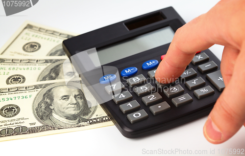 Image of Calculator and money - accounting concept