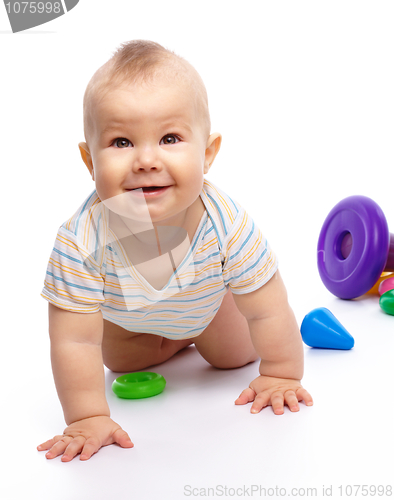 Image of Little boy play with toys