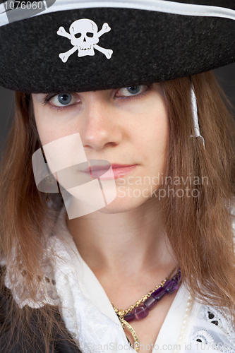 Image of Portrait of serious pirate woman in hat close-up