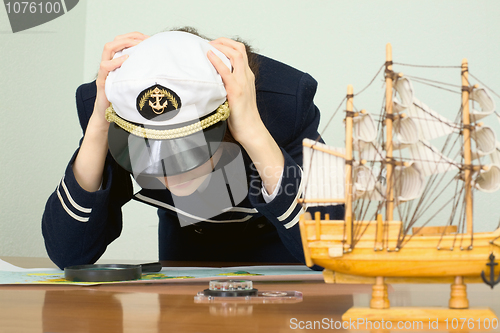 Image of Depressed girl in a sea uniform