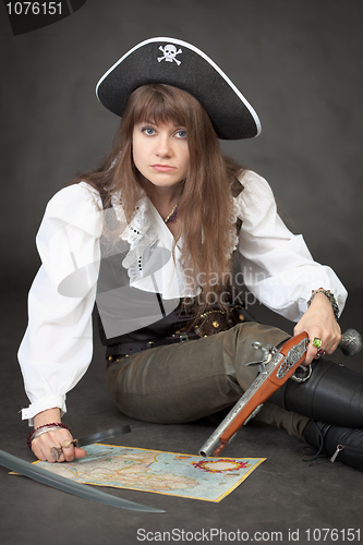 Image of Woman - pirate with sea map and pistol