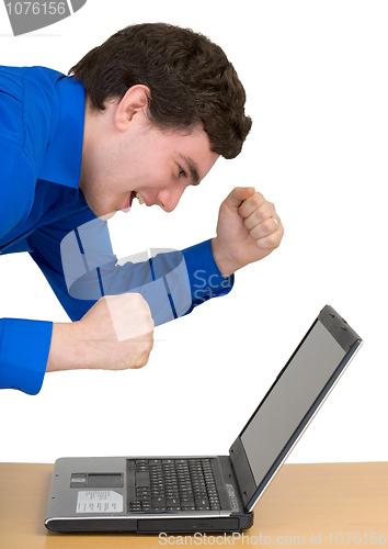 Image of Emotional young man with the laptop