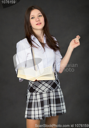 Image of Girl with the book in hand on black