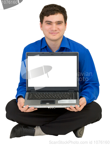 Image of Guy sits on a floor with the laptop