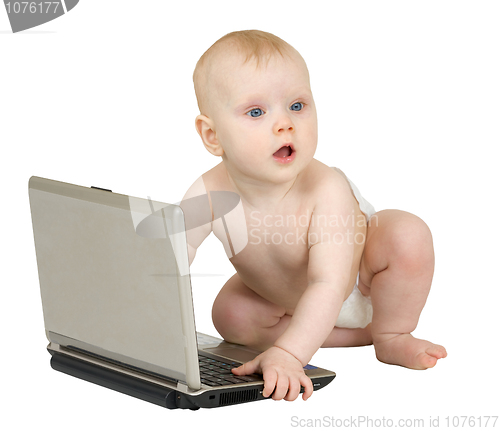 Image of Baby with the laptop on white