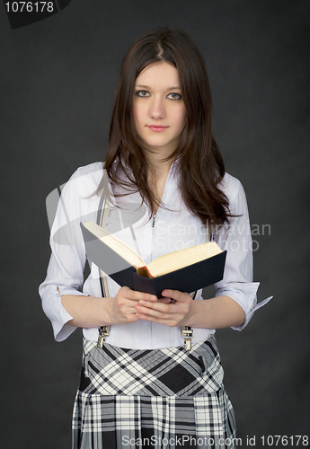 Image of Portrait of the schoolgirl reading the book