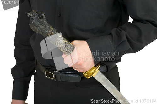 Image of Chinese sword in a hand at the man