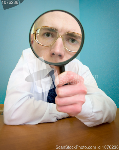 Image of Funny people with a magnifier