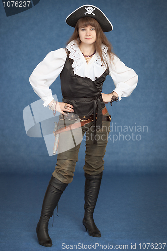 Image of Beautiful girl - pirate stand on blue background