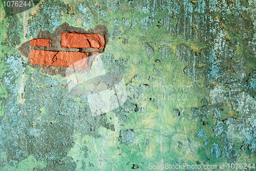 Image of Damaged old brick wall with hole