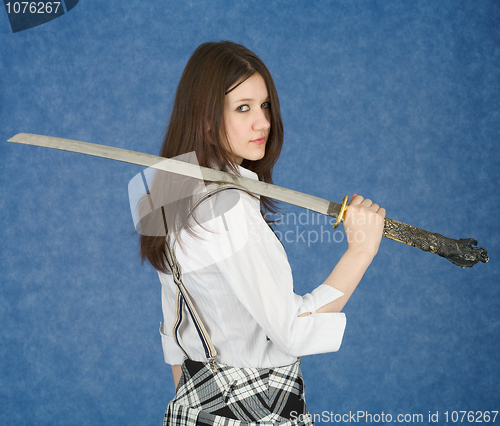 Image of Young woman with the Japanese sword in a hand