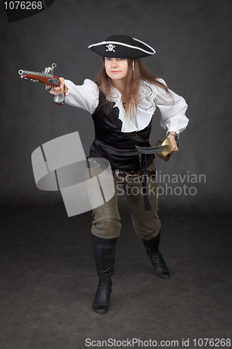 Image of Pirate girl rush to the attack with gun