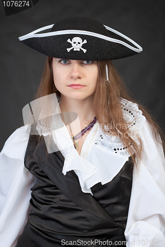 Image of Portrait of serious pirate woman in hat