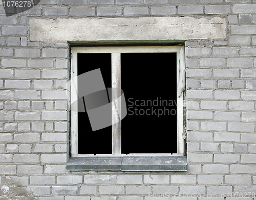 Image of Dark window of the thrown old building
