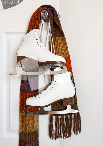 Image of Figure skates and colourful scarf