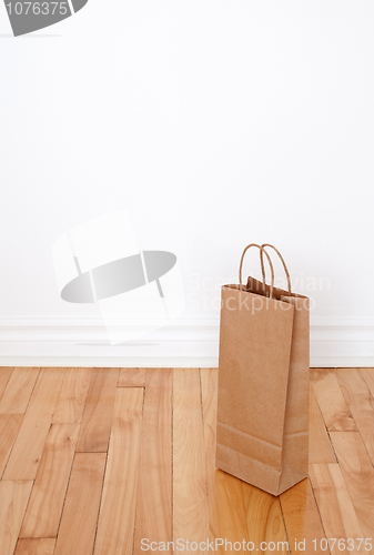 Image of Paper bag on wooden floor