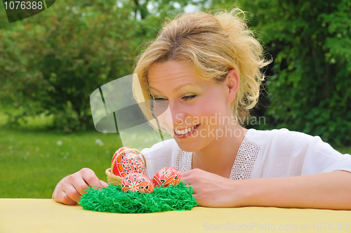 Image of Young woman and easter eggs