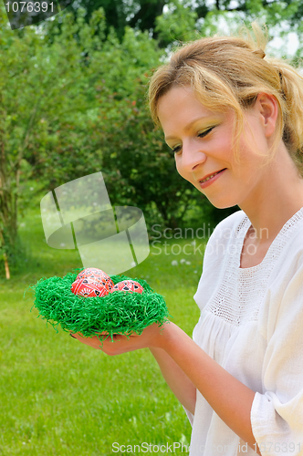 Image of Young woman and easter eggs