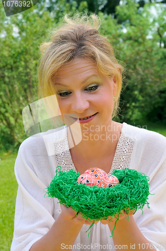 Image of Young woman and easter eggs