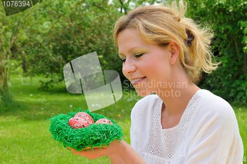 Image of Young woman and easter eggs