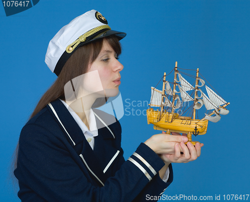 Image of Girl blowing on sails of the ship