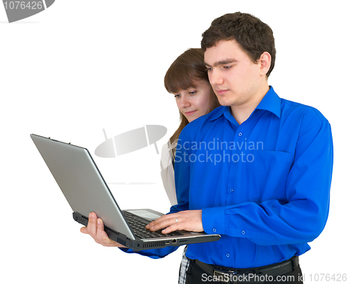 Image of Young couple with the laptop