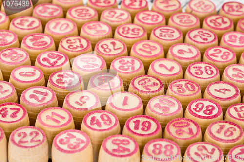 Image of Wooden counters for bingo with red numbers