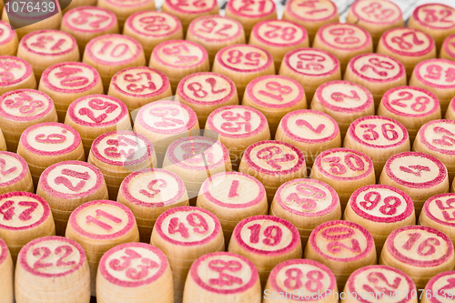 Image of Wooden counters for bingo with red numbers