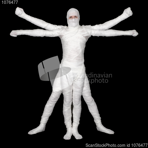 Image of Vitruvian Man - bandaged mummy on black background