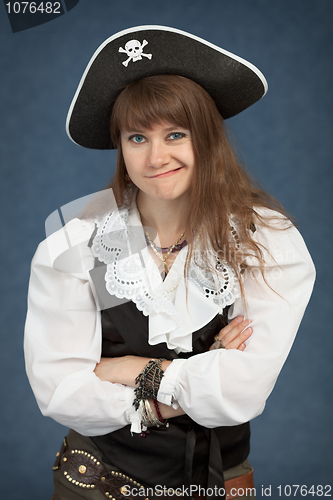 Image of Young beautiful girl the pirate pulls faces