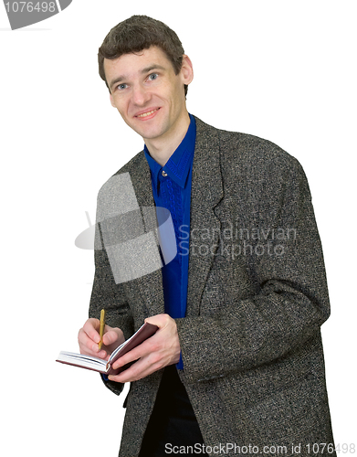 Image of Smiling guy in a suit with a notebook in hands isolated on white