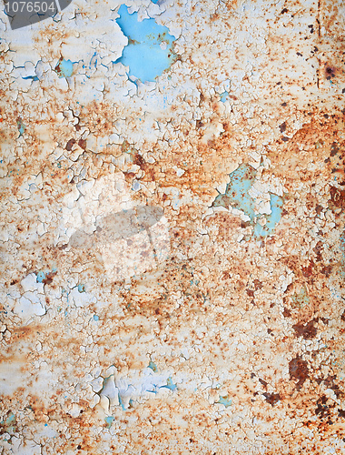 Image of Weathered surface of a steel sheet with paint scraps