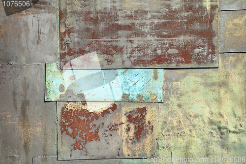 Image of Wall covered with sheets of rusty old iron background