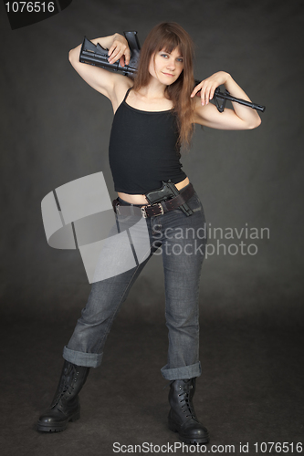 Image of Beautiful young sexy woman with a rifle on shoulders