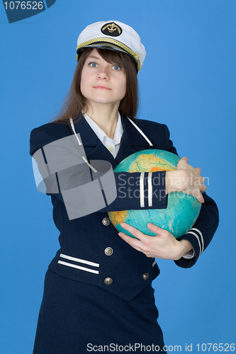 Image of Girl in uniform embrace globe