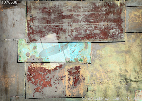 Image of Wall covered with sheets of rusty old steel background