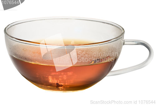 Image of Transparent glass cup with tea on white background