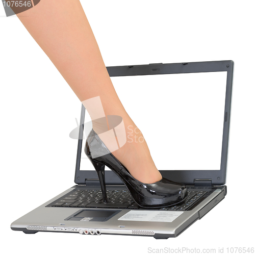 Image of Female foot on the laptop keyboard - game over