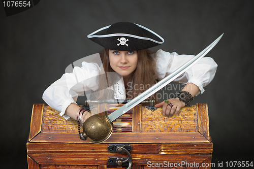 Image of Woman pirate with a sabre and treasures