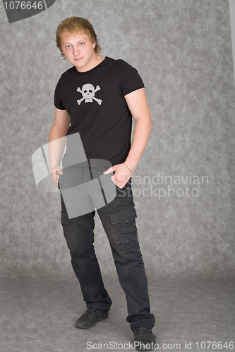 Image of Young guy in a T-shirt with piracy symbolics