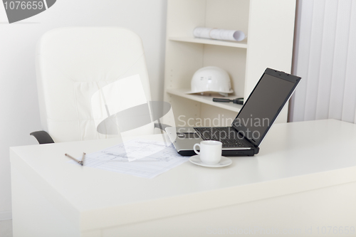 Image of Workplace of engineer at office with laptop