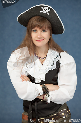 Image of Pirate woman emotionally poses on blue background