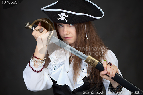 Image of Portrait of woman in pirate hat with sabre in hands
