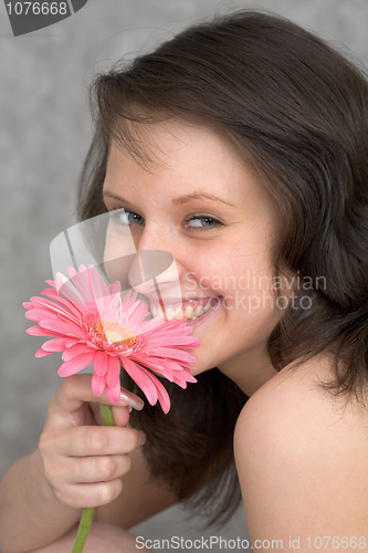 Image of Portrait of the beautiful girl with flower chrysanthemum