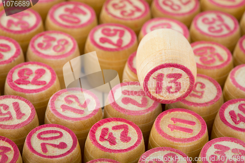 Image of Number thirteen on wooden counter bingo