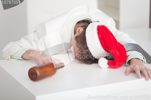 Image of Businessman has finished Christmas celebrating at office on work