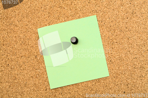Image of Stickers pinned to a cork board