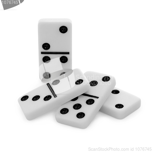 Image of Pile from bones of dominoes on white background